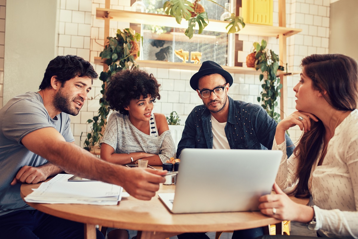 Employees brainstorming in a cafe