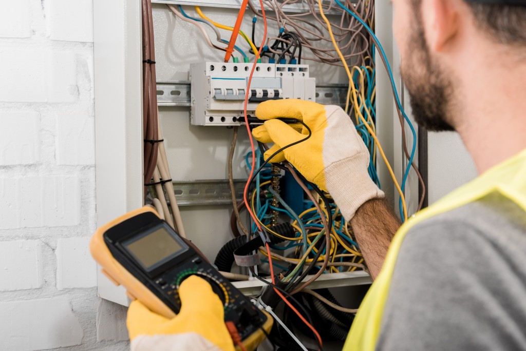 Electrician checking the electric box