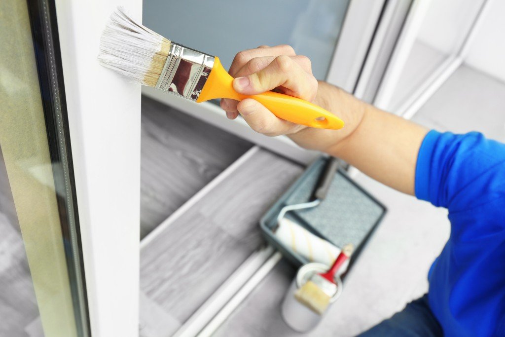 Man applying coat of paint