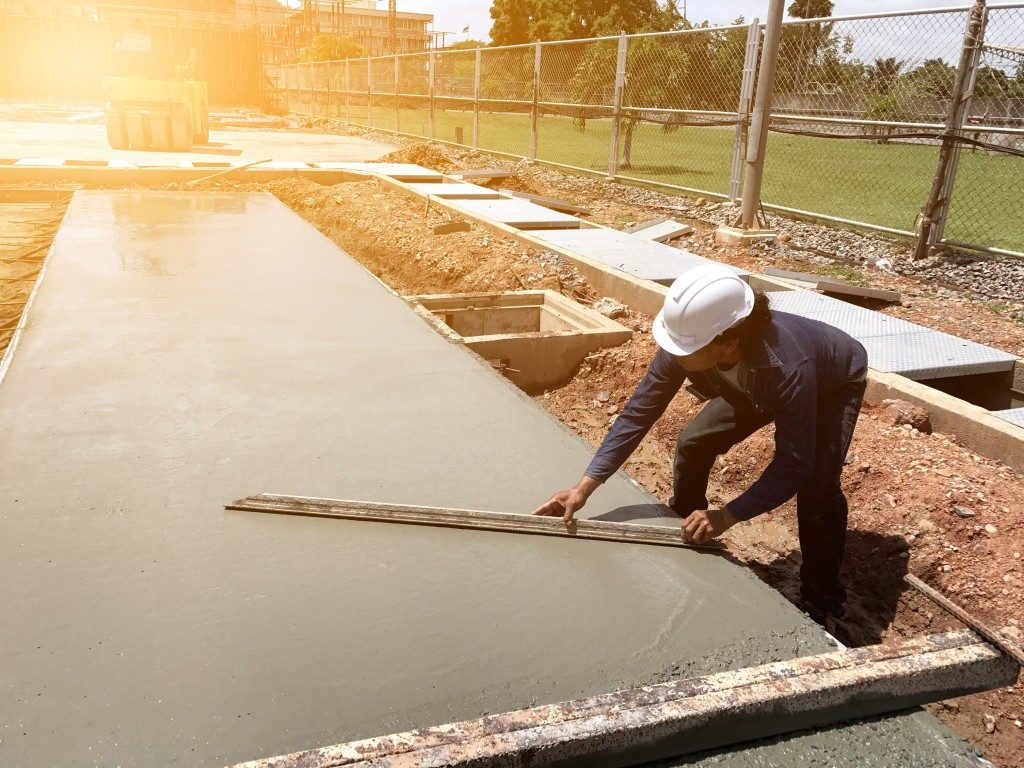man polishing a concrete slab