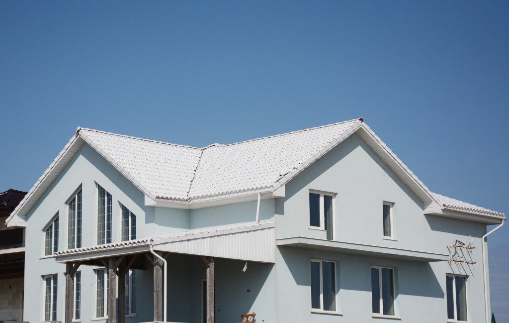 big size house in white colored cool roof