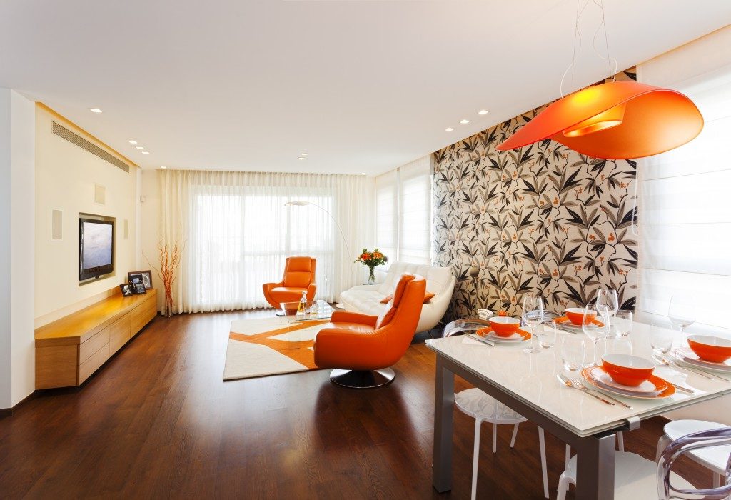 orange furniture and wallpaper on apartment interior