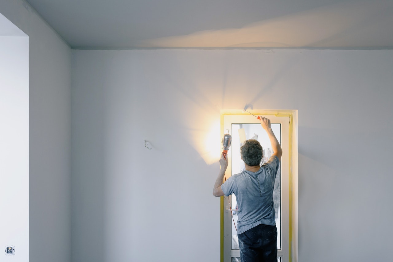 a man installing a door