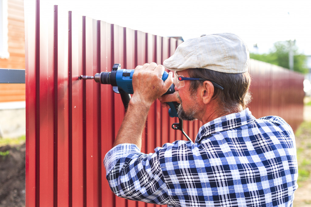 man installing fences